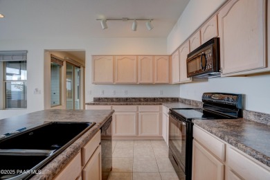 Lovely home located on a charming tree-lined street in the heart on StoneRidge Golf Course in Arizona - for sale on GolfHomes.com, golf home, golf lot