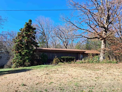 LARGE, SINGLE LEVEL HOME, SMALL PRICE!! This almost 2000 sq. ft on Cherokee Village North Course in Arkansas - for sale on GolfHomes.com, golf home, golf lot
