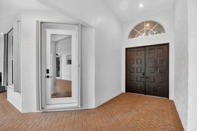 Stunning courtyard home in Mizner Country Club offering on Mizner Country Club in Florida - for sale on GolfHomes.com, golf home, golf lot