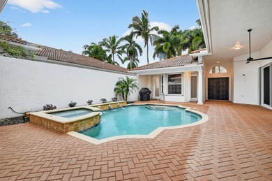 Stunning courtyard home in Mizner Country Club offering on Mizner Country Club in Florida - for sale on GolfHomes.com, golf home, golf lot