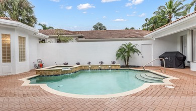 Stunning courtyard home in Mizner Country Club offering on Mizner Country Club in Florida - for sale on GolfHomes.com, golf home, golf lot