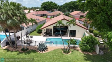 Charming 2-bedroom, 2-bath single-family home offers an array of on Boca Woods Country Club in Florida - for sale on GolfHomes.com, golf home, golf lot