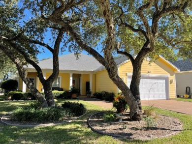 Welcome to this spacious Heron's Roost retreat under the trees! on Rockport Country Club in Texas - for sale on GolfHomes.com, golf home, golf lot