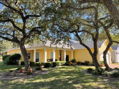 Welcome to this spacious Heron's Roost retreat under the trees! on Rockport Country Club in Texas - for sale on GolfHomes.com, golf home, golf lot