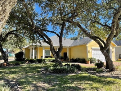 Welcome to this spacious Heron's Roost retreat under the trees! on Rockport Country Club in Texas - for sale on GolfHomes.com, golf home, golf lot