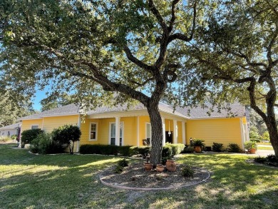 Welcome to this spacious Heron's Roost retreat under the trees! on Rockport Country Club in Texas - for sale on GolfHomes.com, golf home, golf lot