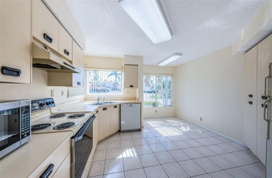 ** REDUCED PRICE ** Enjoy paradise in this comfortable on Isla Del Sol Yacht and Country Club in Florida - for sale on GolfHomes.com, golf home, golf lot