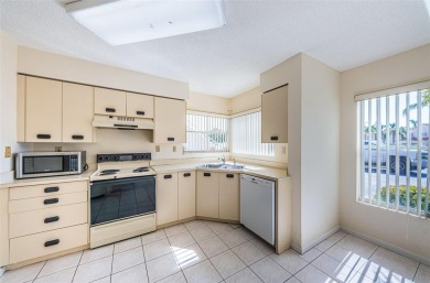 ** REDUCED PRICE ** Enjoy paradise in this comfortable on Isla Del Sol Yacht and Country Club in Florida - for sale on GolfHomes.com, golf home, golf lot