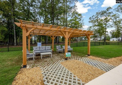 This exceptional and generous .29-acre homesite offers a serene on Timberlake Country Club in South Carolina - for sale on GolfHomes.com, golf home, golf lot