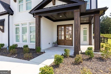 Welcome home to this executive home built by the Toll Brothers on Capital City Club Crabapple in Georgia - for sale on GolfHomes.com, golf home, golf lot