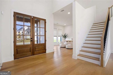 Welcome home to this executive home built by the Toll Brothers on Capital City Club Crabapple in Georgia - for sale on GolfHomes.com, golf home, golf lot