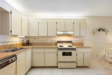 Bright and open second floor corner unit in Banyan House.  This on Martin County Golf Course in Florida - for sale on GolfHomes.com, golf home, golf lot