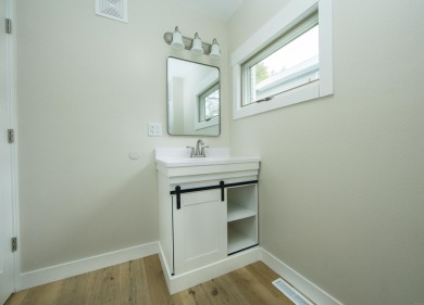 This beautifully redone 3-bedroom, 1-bathroom home offers modern on Nashua Town and Country Club in Iowa - for sale on GolfHomes.com, golf home, golf lot