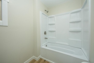 This beautifully redone 3-bedroom, 1-bathroom home offers modern on Nashua Town and Country Club in Iowa - for sale on GolfHomes.com, golf home, golf lot