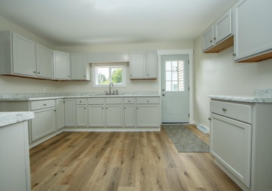 This beautifully redone 3-bedroom, 1-bathroom home offers modern on Nashua Town and Country Club in Iowa - for sale on GolfHomes.com, golf home, golf lot