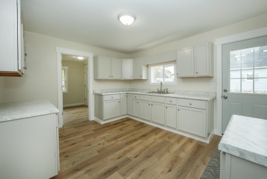 This beautifully redone 3-bedroom, 1-bathroom home offers modern on Nashua Town and Country Club in Iowa - for sale on GolfHomes.com, golf home, golf lot