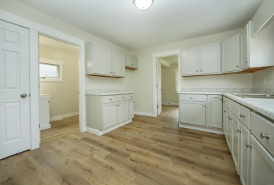 This beautifully redone 3-bedroom, 1-bathroom home offers modern on Nashua Town and Country Club in Iowa - for sale on GolfHomes.com, golf home, golf lot