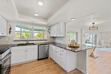 WATERFRONT SERENITY IN NEW PORT RICHEY - YOUR COASTAL ESCAPE on Gulf Harbors Golf Course in Florida - for sale on GolfHomes.com, golf home, golf lot