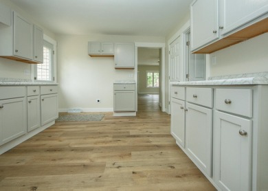 This beautifully redone 3-bedroom, 1-bathroom home offers modern on Nashua Town and Country Club in Iowa - for sale on GolfHomes.com, golf home, golf lot