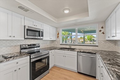 WATERFRONT SERENITY IN NEW PORT RICHEY - YOUR COASTAL ESCAPE on Gulf Harbors Golf Course in Florida - for sale on GolfHomes.com, golf home, golf lot