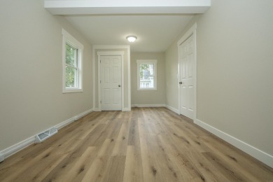 This beautifully redone 3-bedroom, 1-bathroom home offers modern on Nashua Town and Country Club in Iowa - for sale on GolfHomes.com, golf home, golf lot