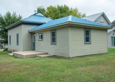 This beautifully redone 3-bedroom, 1-bathroom home offers modern on Nashua Town and Country Club in Iowa - for sale on GolfHomes.com, golf home, golf lot