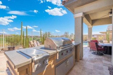 This stunning oasis is located on the 16th hole in Estrella's on Estrella Mountain Ranch Golf Course in Arizona - for sale on GolfHomes.com, golf home, golf lot