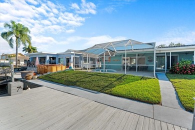 WATERFRONT SERENITY IN NEW PORT RICHEY - YOUR COASTAL ESCAPE on Gulf Harbors Golf Course in Florida - for sale on GolfHomes.com, golf home, golf lot