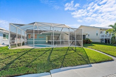 WATERFRONT SERENITY IN NEW PORT RICHEY - YOUR COASTAL ESCAPE on Gulf Harbors Golf Course in Florida - for sale on GolfHomes.com, golf home, golf lot