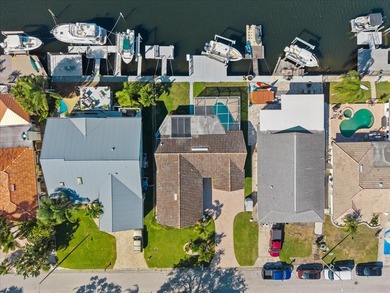 WATERFRONT SERENITY IN NEW PORT RICHEY - YOUR COASTAL ESCAPE on Gulf Harbors Golf Course in Florida - for sale on GolfHomes.com, golf home, golf lot