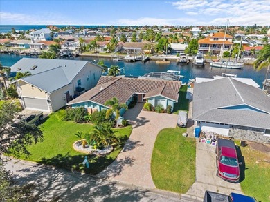 WATERFRONT SERENITY IN NEW PORT RICHEY - YOUR COASTAL ESCAPE on Gulf Harbors Golf Course in Florida - for sale on GolfHomes.com, golf home, golf lot