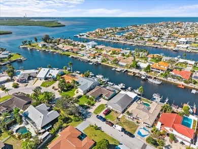 WATERFRONT SERENITY IN NEW PORT RICHEY - YOUR COASTAL ESCAPE on Gulf Harbors Golf Course in Florida - for sale on GolfHomes.com, golf home, golf lot