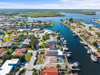 WATERFRONT SERENITY IN NEW PORT RICHEY - YOUR COASTAL ESCAPE on Gulf Harbors Golf Course in Florida - for sale on GolfHomes.com, golf home, golf lot