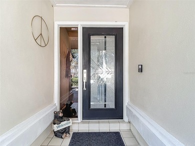 This four bedroom, 3 and a half bathroom pool home is nestled in on Tampa Palms Golf and Country Club in Florida - for sale on GolfHomes.com, golf home, golf lot