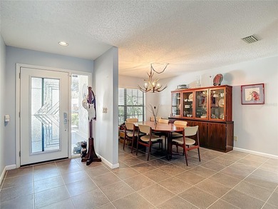 This four bedroom, 3 and a half bathroom pool home is nestled in on Tampa Palms Golf and Country Club in Florida - for sale on GolfHomes.com, golf home, golf lot