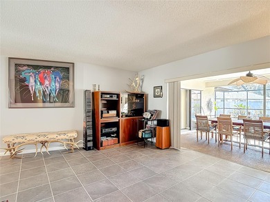 This four bedroom, 3 and a half bathroom pool home is nestled in on Tampa Palms Golf and Country Club in Florida - for sale on GolfHomes.com, golf home, golf lot