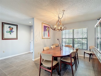 This four bedroom, 3 and a half bathroom pool home is nestled in on Tampa Palms Golf and Country Club in Florida - for sale on GolfHomes.com, golf home, golf lot