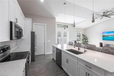 Rare opportunity in Bonita Springs: a nearly new 2023-built on Raptor Bay Golf Club in Florida - for sale on GolfHomes.com, golf home, golf lot