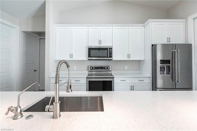 Rare opportunity in Bonita Springs: a nearly new 2023-built on Raptor Bay Golf Club in Florida - for sale on GolfHomes.com, golf home, golf lot