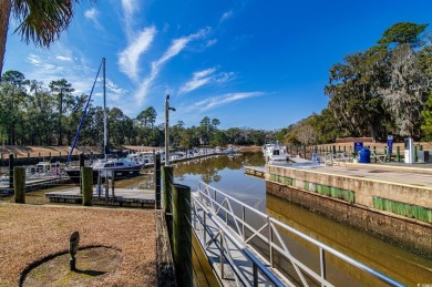Welcome to this stunning lakefront home located in the highly on The Reserve Golf Club at Pawleys Island in South Carolina - for sale on GolfHomes.com, golf home, golf lot