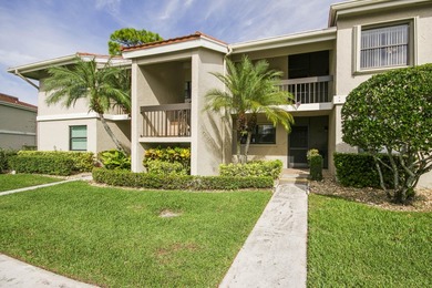 Delightful Eastpointe condo with gorgeous lake and golf views on Old Marsh Golf Club in Florida - for sale on GolfHomes.com, golf home, golf lot