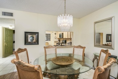 Delightful Eastpointe condo with gorgeous lake and golf views on Old Marsh Golf Club in Florida - for sale on GolfHomes.com, golf home, golf lot