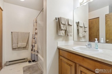 Enjoy easy main-floor living in this 2-bedroom, 1-bath end-unit on Collindale Golf Course in Colorado - for sale on GolfHomes.com, golf home, golf lot