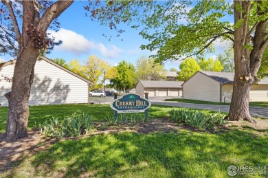 Enjoy easy main-floor living in this 2-bedroom, 1-bath end-unit on Collindale Golf Course in Colorado - for sale on GolfHomes.com, golf home, golf lot