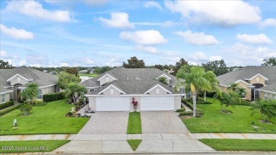 Live the good life in this upscale lakefront villa in Viera on Viera East Golf Club in Florida - for sale on GolfHomes.com, golf home, golf lot