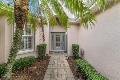 Live the good life in this upscale lakefront villa in Viera on Viera East Golf Club in Florida - for sale on GolfHomes.com, golf home, golf lot