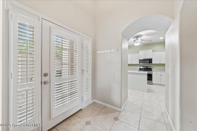 Live the good life in this upscale lakefront villa in Viera on Viera East Golf Club in Florida - for sale on GolfHomes.com, golf home, golf lot