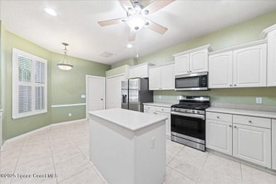 Live the good life in this upscale lakefront villa in Viera on Viera East Golf Club in Florida - for sale on GolfHomes.com, golf home, golf lot