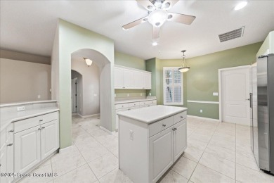 Live the good life in this upscale lakefront villa in Viera on Viera East Golf Club in Florida - for sale on GolfHomes.com, golf home, golf lot