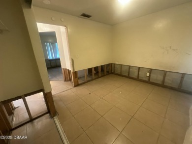 Are you an investor or homebuyer looking for a project? This on Daytona Beach Golf Club in Florida - for sale on GolfHomes.com, golf home, golf lot